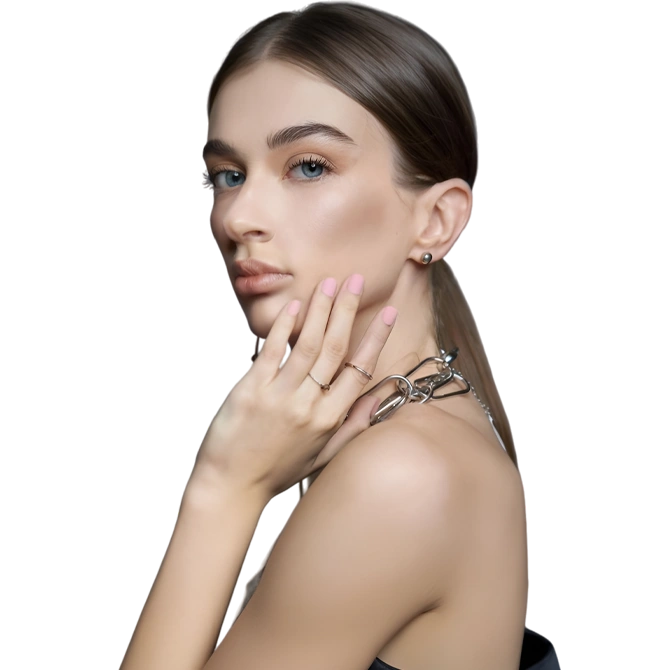 Model with sleek hair striking makeup poses eyeliner features green accents her nails are painted vibrant hues highlighting contemporary fashion